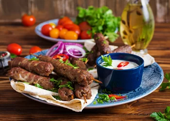 turkish-arabic-traditional-ramadan-mix-kebab-plate-kebab-adana-chicken-lamb-beef-lavash-bread-with-sauce-top-view_2829-6170